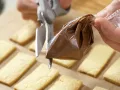 Orangenblätter, Nugatstreifen und Kokosringe Zubereitung Schritt 7 Orangenblätter, Nugatstreifen und Kokosringe Zubereitung Schritt 7