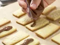 Orangenblätter, Nugatstreifen und Kokosringe Zubereitung Schritt 8 Orangenblätter, Nugatstreifen und Kokosringe Zubereitung Schritt 8