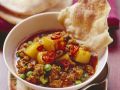 Hacktopf mit Kartoffeln und Erbsen auf indische Art Rezept