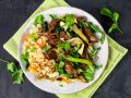 Möhrenreis mit Rindfleischstreifen, Austernpilzen und Pak Choi Rezept