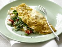 Gefülltes Omelett mit Tomaten, Pilzen und Schafskäse Rezept