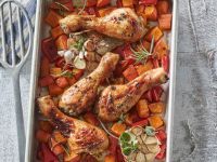 Honig-Hähnchenkeulen mit Kürbis und Paprika Rezept