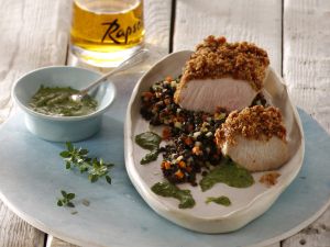 Spanferkelbraten auf schwarzem Linsengemüse Rezept